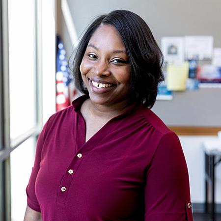 Cheerful military spouse smiling at the camera